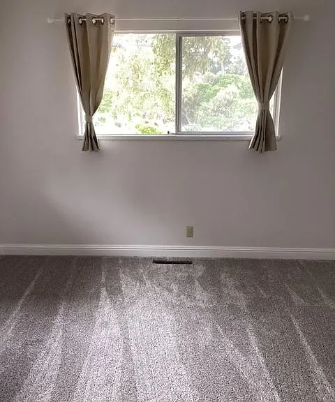 East bedroom. Carpeted, cedar floor in closet.