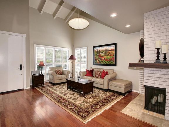 Newer windows throughout the home with plantation shutters and wood floors.  New paint and recessed lighting.