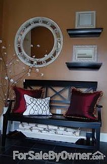 Foyer
						:
						Tile floor, crown molding, coat closet, two transom windows, intercom system
