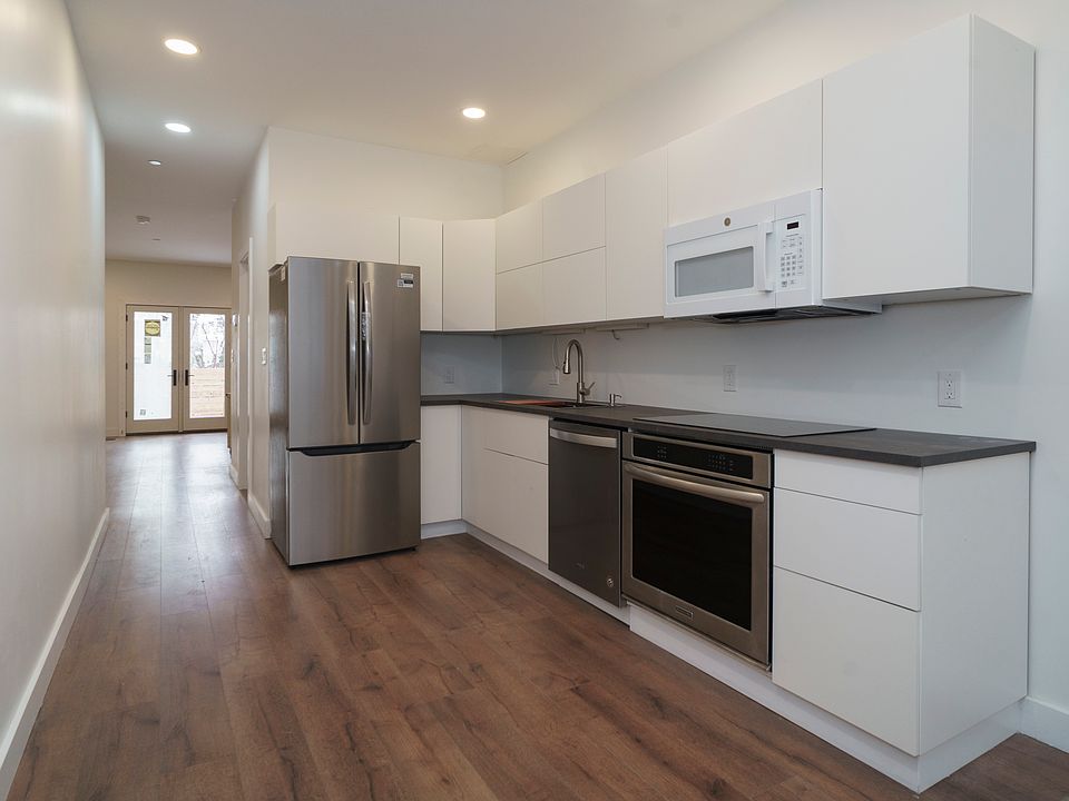 View of kitchen from apartment entryway