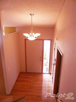 Lovely light filled entry way with hardwood floors.