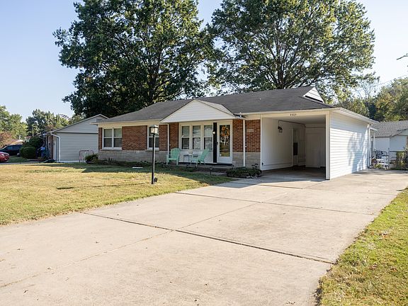 1-car carport with double wide, extended driveway.