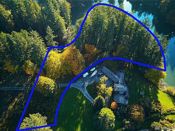 Southern view of the property with view of neighboring home along Manzanita Bay.