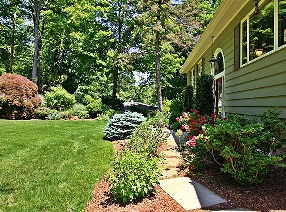 Front side pathway to front door from deck and gardens.