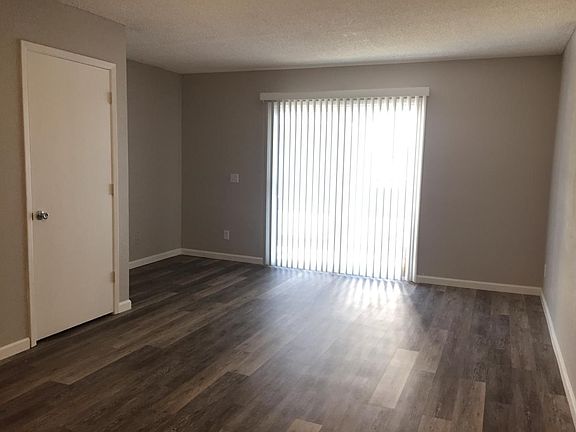 Living Room; new flooring, exits to patio