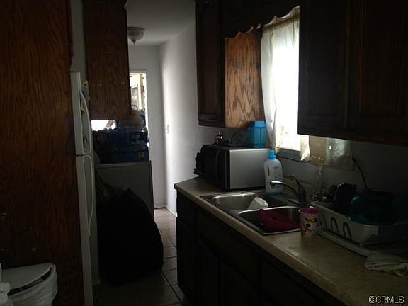 FRONT HOUSE KITCHEN, AND HALLWAY TO THE BACK YARD