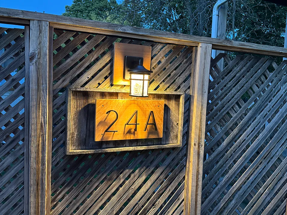 Evening view of the highly visible address distinguishing between the 2 units; 24 Ash Street, lower unit and 24A Ash Street, upper unit