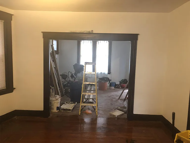 View from eat in kitchen to large dining room into the family room still under construction