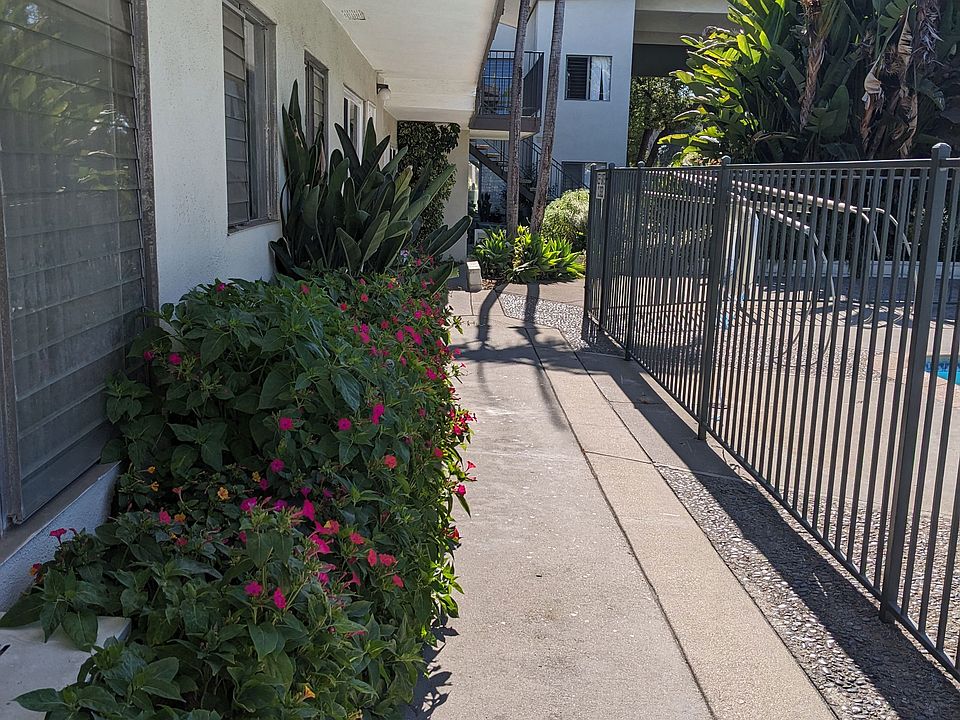 Walkway inside gated area beside pool and apartment enterances at Los Robles Apartments in Pasadena, California.