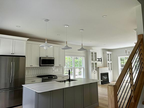 Kitchen, dining area into living area view