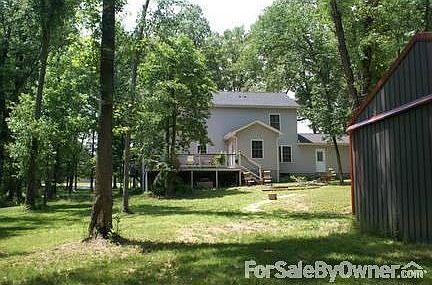 Back View
						:
						This view is from the large, partially finished pole barn.