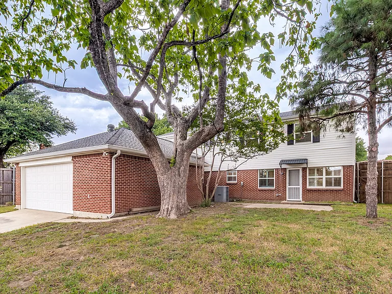 Backyard with access to house and separate door to garage.