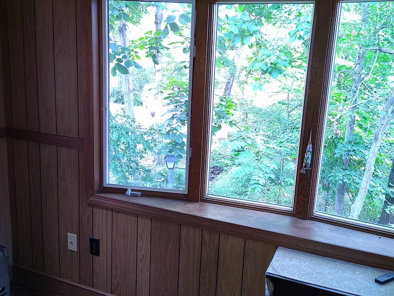 3-season enclosed porch room in back of house.