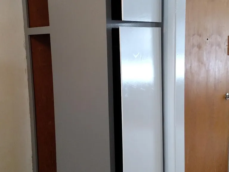 Corner coat and storage cabinet.