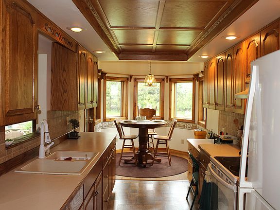 The galley kitchen offers lots of counter space is capped off with a great eating area.