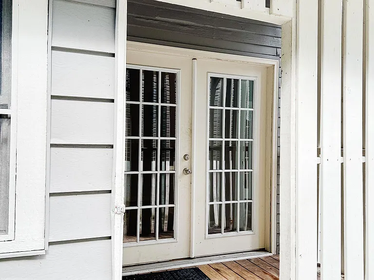 Covered porch off the kitchen leading to private patio