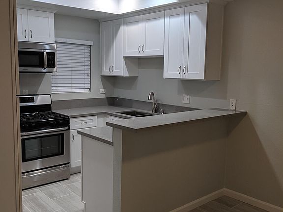 Kitchen Renovated on May 2019: quartz countertops, porcelain tile flooring, shaker cabinets and stainless steel appliances and s