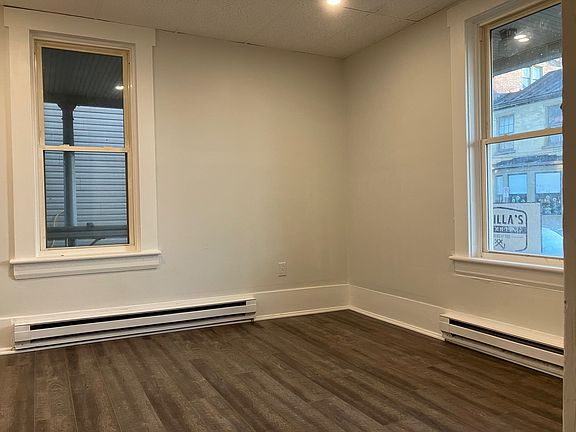Spacious living room with new windows, fresh paint, recessed lighting, and great natural light.