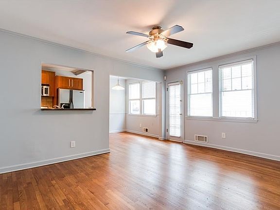 View of dining area and kitchen from living room