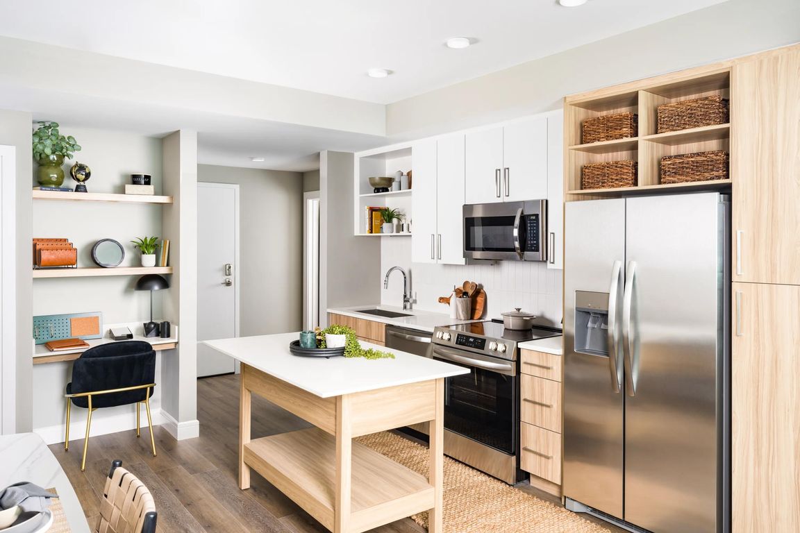 An open kitchen at Modera McGavock, featuring upscale finishes and flexible space, with quick access to Nashville's dining, music, and everyday essentials.