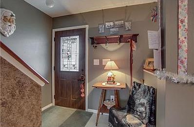 Entry is inviting and open to a formal living space.