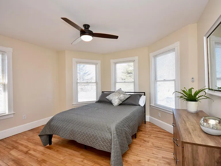 Bedroom with bay window, queen bed, 43" Smart TV, Payson Park and Back Cove View