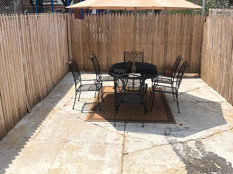 Outside fenced in yard with patio area