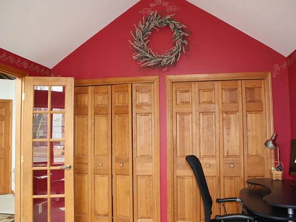Opposite view of the office shows the double closets and french doors. This room could serve as a 4th bedroom or guest room if needed.