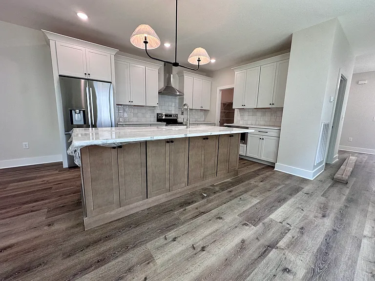Modern Kitchen with Stainless Appliances and Under-Counter Microwave