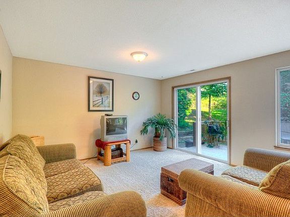Family room off kitchen leads out to private deck and yard area.