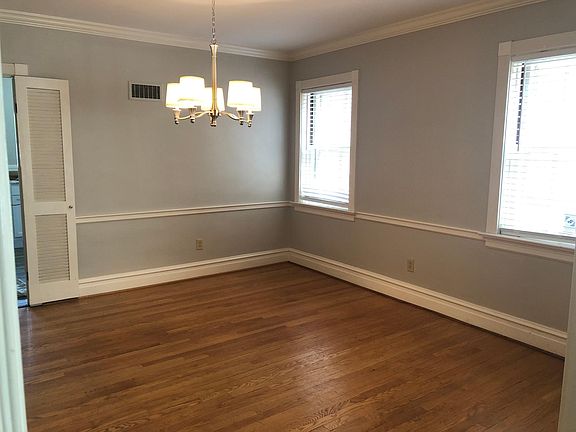 Dining room: Spacious with crown molding and new chandelier.
