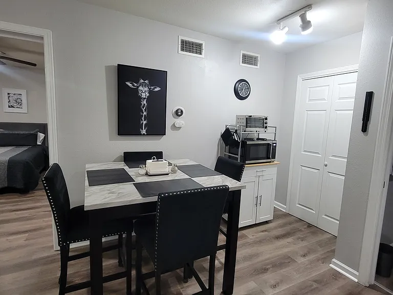 Dining area with bar height table and chairs