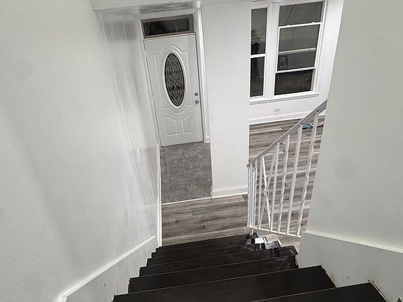 View of Living room from upstairs( New stairs and painted as well)