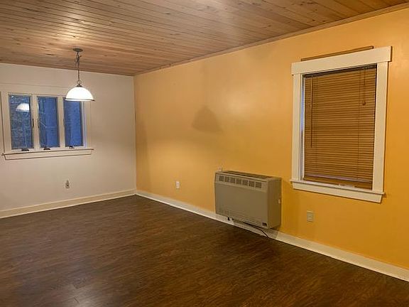 First floor has additional electric heat, while basement has a radiant heat slab which throws additional warmth into the other floors of the house. In the summer you can use a fan or a window air conditioner, but since the house is shaded by trees it is u