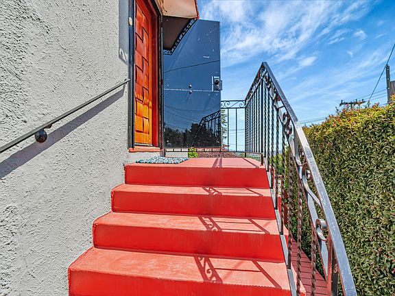 Stairs to the front door. To preserve the door against the sun, I installed the security door and attached plastic panels.