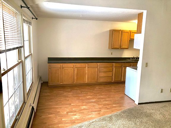 Dining area with hard wood floors and excess counter space.