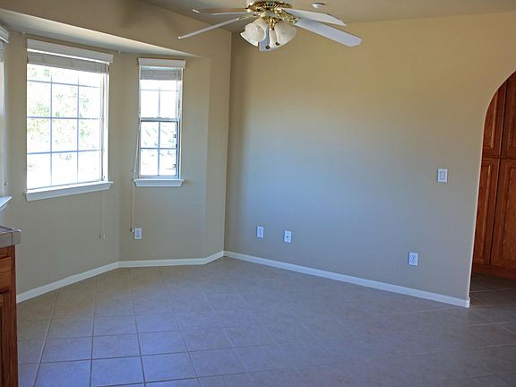 The dining alcove has three windows to let in plenty of light.