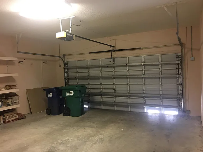 two car garage with shelves