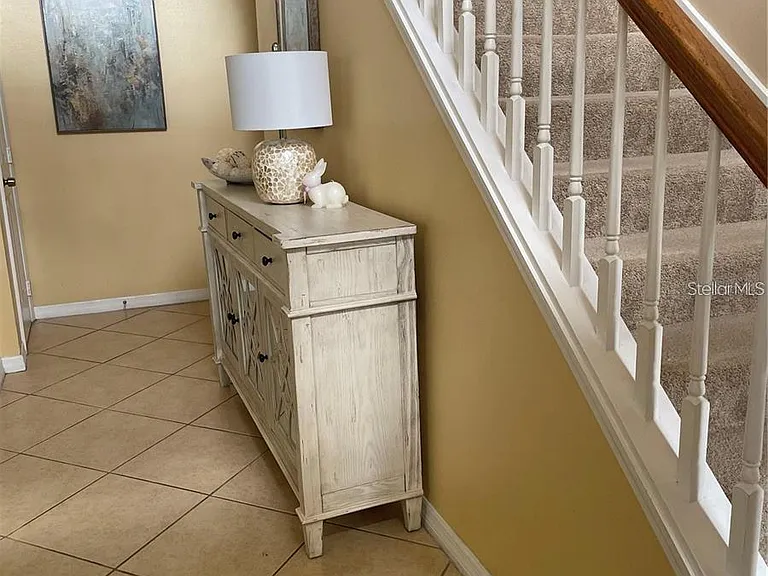ENTRY OF HOME WITH TILE FLOOR ALL ON THE FIRST FLOOR