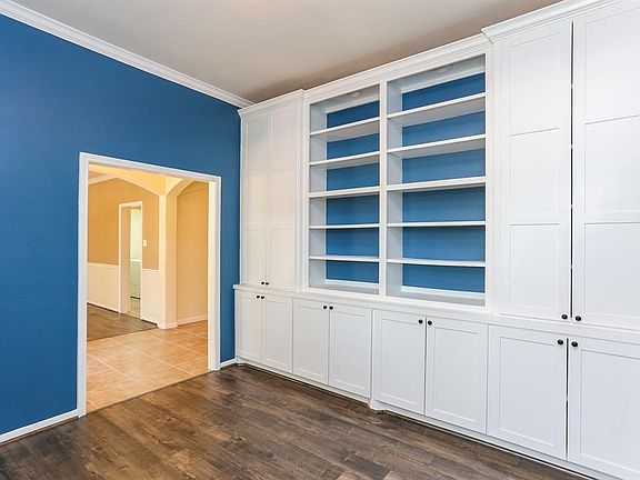 Admire the beautiful white cabinetry featured in this home's study.