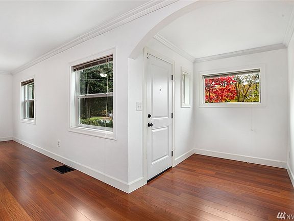 Front entry way area with nice wide archway. Lot's of picture windows allowing natural light to filter through. Newer windows throughout with covered blinds. 