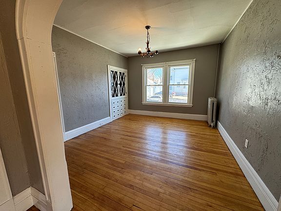 Dining room with built-in cabinetry and large window