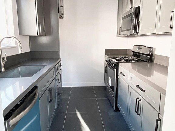 BRAND NEW FULL GUT RENOVATED KITCHEN - ALL NEW APPLIANCES - (INCLUDES FRIDGE - not pictured)