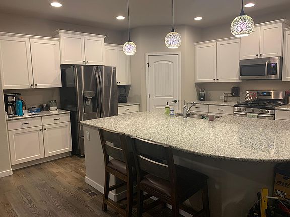 Wide open kitchen with huge bar and lots of storage