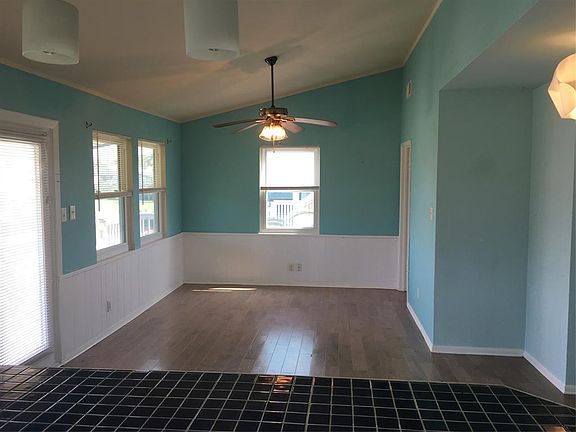 Spacious living/dining combo with a lot of natural sunlight. Vaulted ceiling.