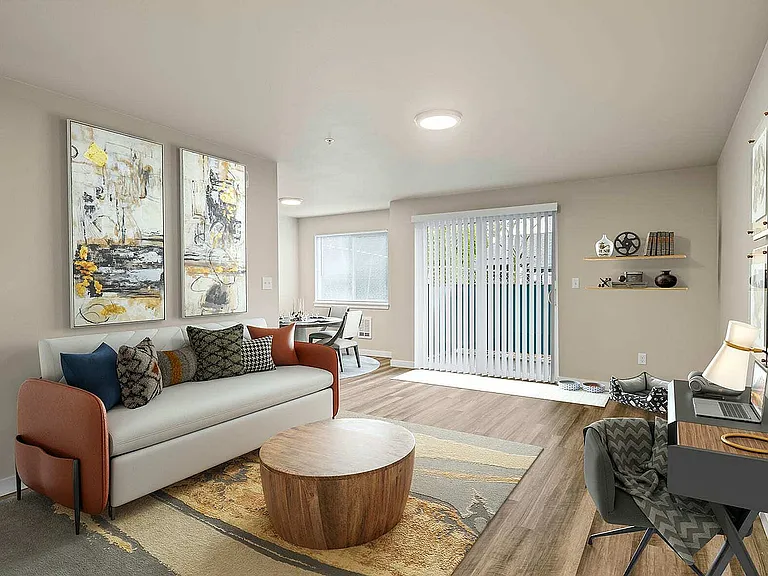 Spacious living room and dining nook in Foster Creek apartments, Tukwila, WA.