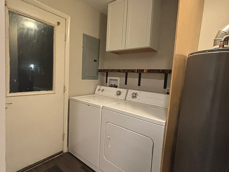 Additional laundry room storage and modern shelves for freqently used items