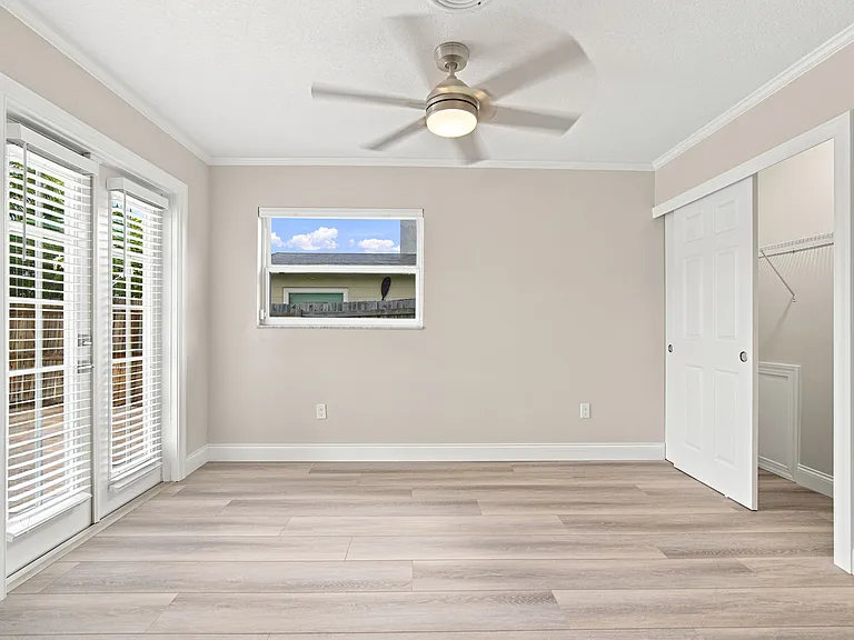 Third bedroom with french doors with direct pool access.