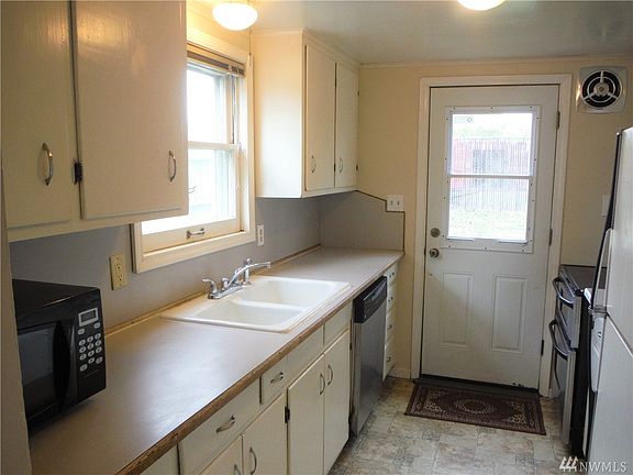 Kitchen includes all appliances & has a door to the fenced back yard