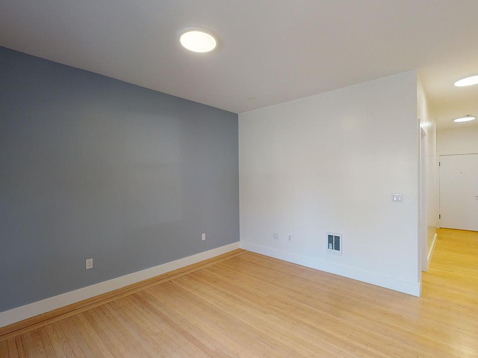 Living area with a wood-like flooring